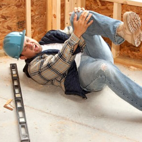 Worker lying on the floor in pain 